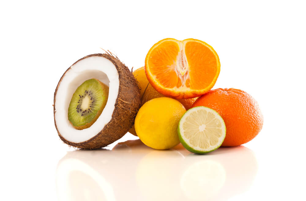 Healthy colorful tropical fresh fruits on white background